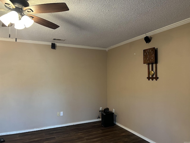 empty room featuring a textured ceiling, dark hardwood / wood-style flooring, ceiling fan, and ornamental molding