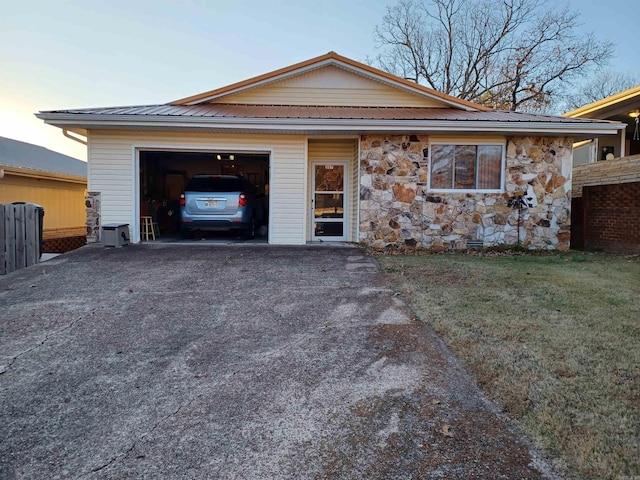 ranch-style house featuring a garage