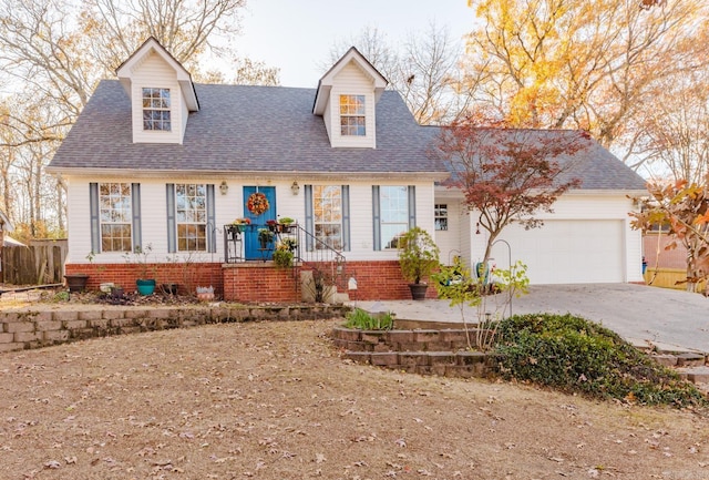 new england style home with a garage