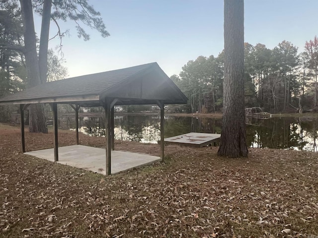 exterior space with a gazebo and a water view