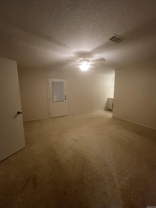 bonus room with carpet flooring, ceiling fan, and a textured ceiling