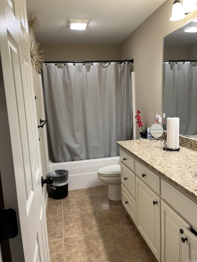 full bathroom featuring shower / bathtub combination with curtain, tile patterned flooring, vanity, and toilet