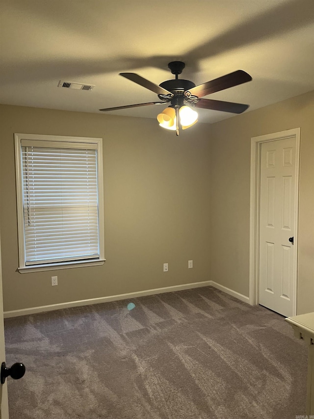 carpeted empty room with ceiling fan