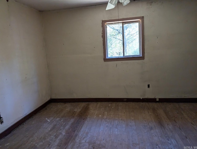 unfurnished room featuring dark wood-type flooring