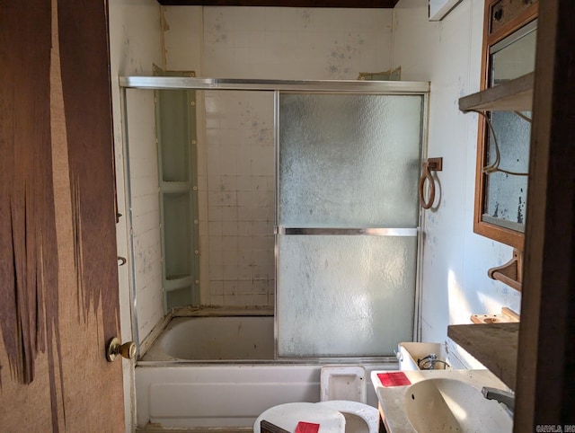 bathroom with vanity and bath / shower combo with glass door