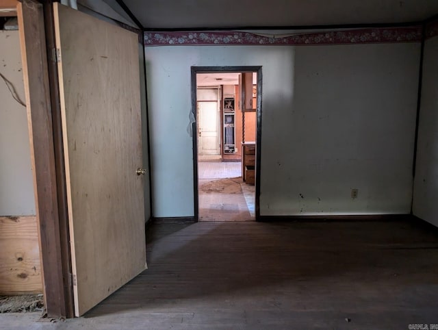 spare room with wood-type flooring