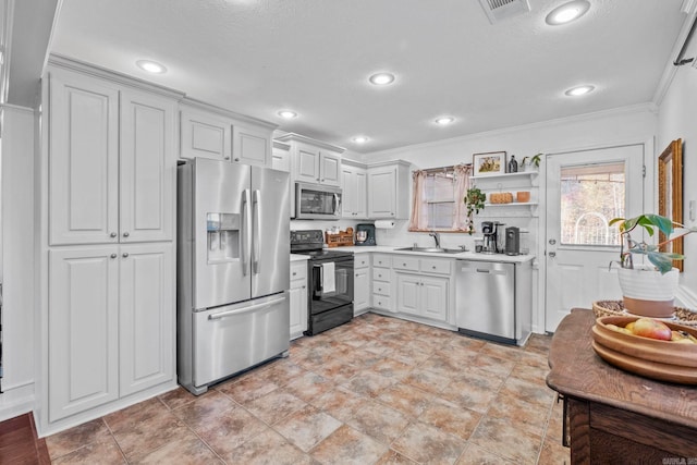 kitchen featuring a textured ceiling, stainless steel appliances, crown molding, sink, and white cabinetry