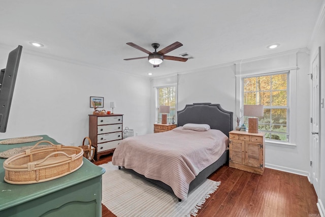 bedroom featuring multiple windows, ceiling fan, dark hardwood / wood-style flooring, and crown molding