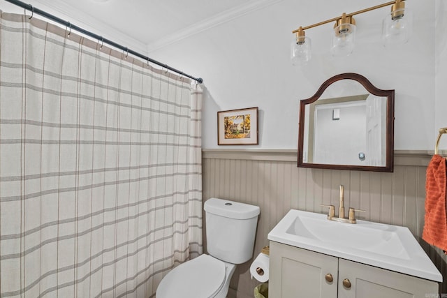 bathroom featuring crown molding, vanity, and toilet