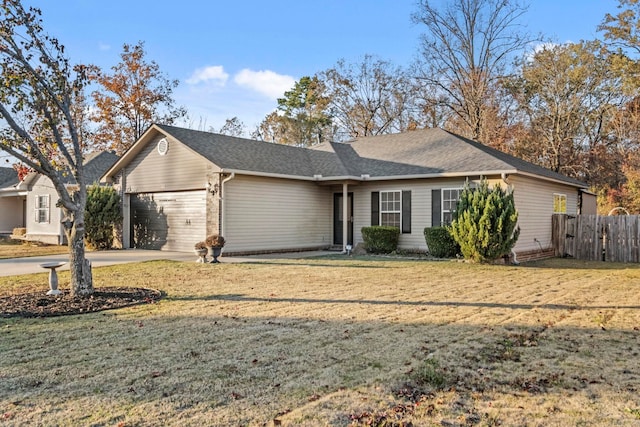 ranch-style home featuring a garage and a front lawn