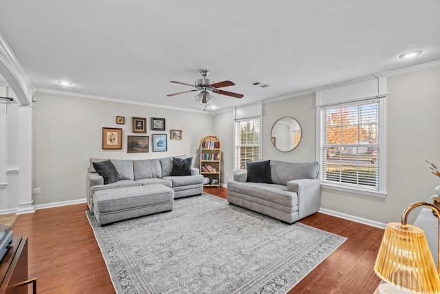 living room featuring ceiling fan, dark hardwood / wood-style flooring, and ornamental molding