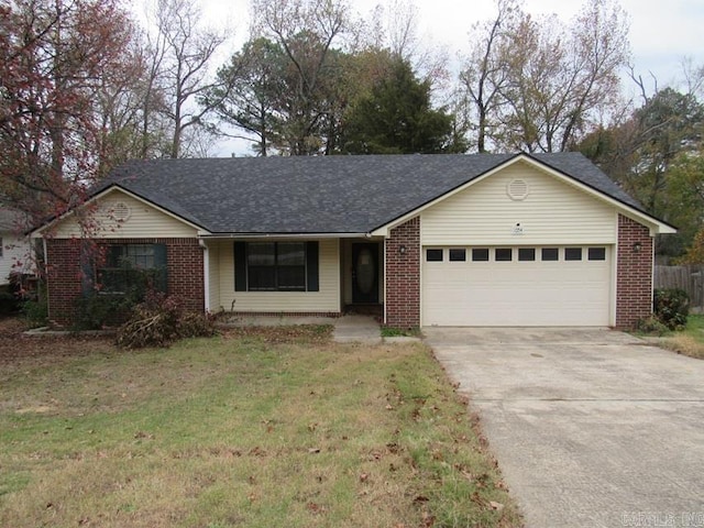 single story home with a front yard and a garage