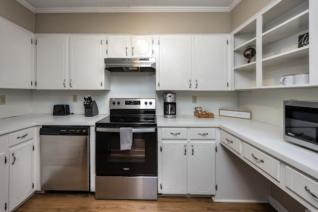 kitchen featuring white cabinetry, ornamental molding, stainless steel appliances, and wood-type flooring