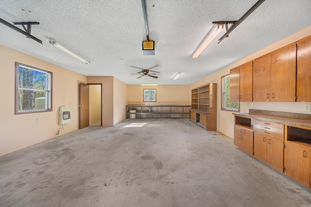 garage with heating unit and ceiling fan