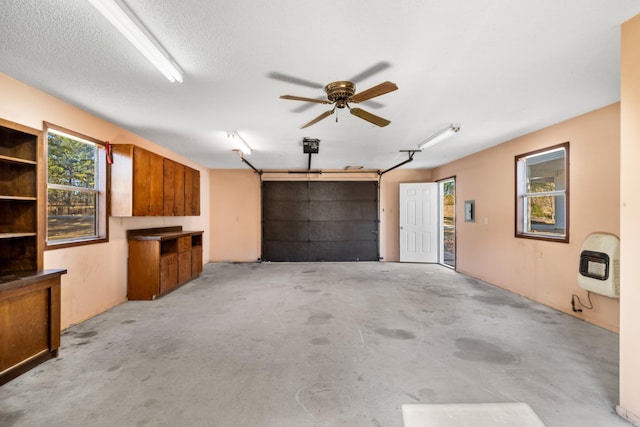 garage with ceiling fan and heating unit