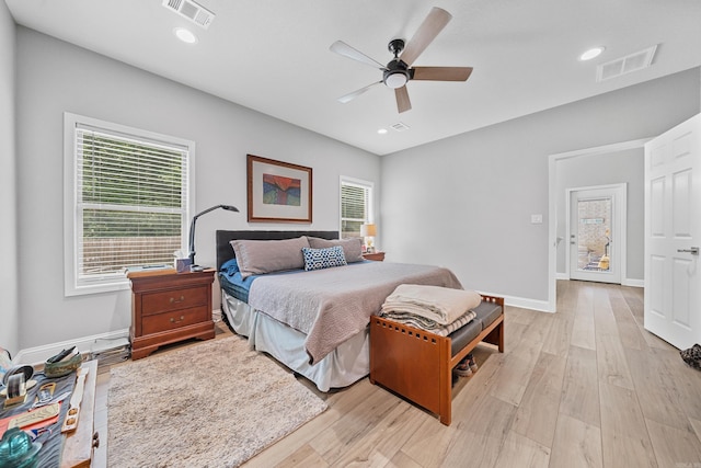 bedroom with light wood-type flooring and ceiling fan