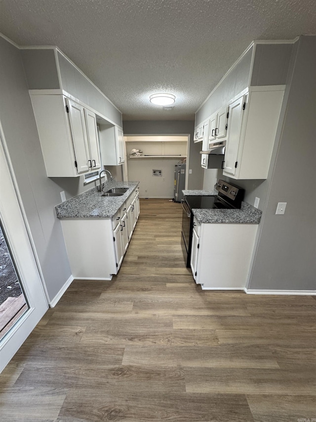 kitchen with range with electric cooktop, sink, light hardwood / wood-style flooring, a textured ceiling, and white cabinets