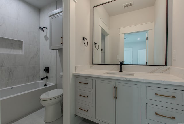 full bathroom featuring vanity, toilet, and tiled shower / bath combo