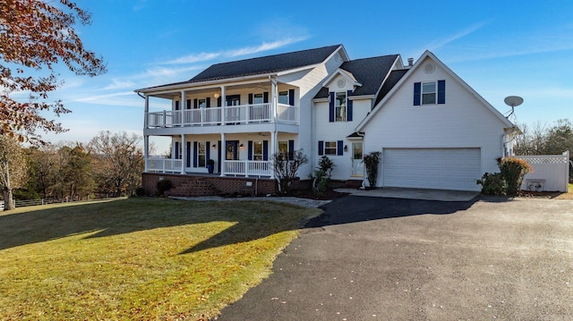 view of front facade featuring covered porch, a balcony, a garage, and a front lawn