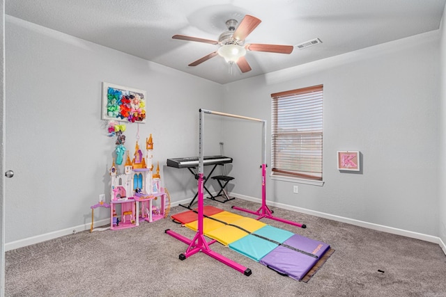 recreation room with carpet and ceiling fan