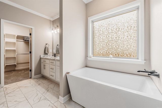 bathroom featuring vanity, a tub to relax in, and crown molding