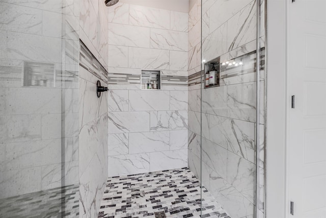 bathroom featuring tiled shower