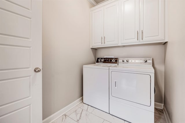 laundry area with cabinets and washer and clothes dryer