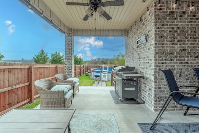 view of patio / terrace with ceiling fan and grilling area