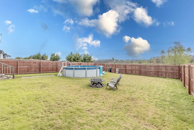 view of yard with a fenced in pool