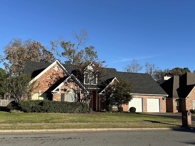 view of front of home featuring a garage and a front yard