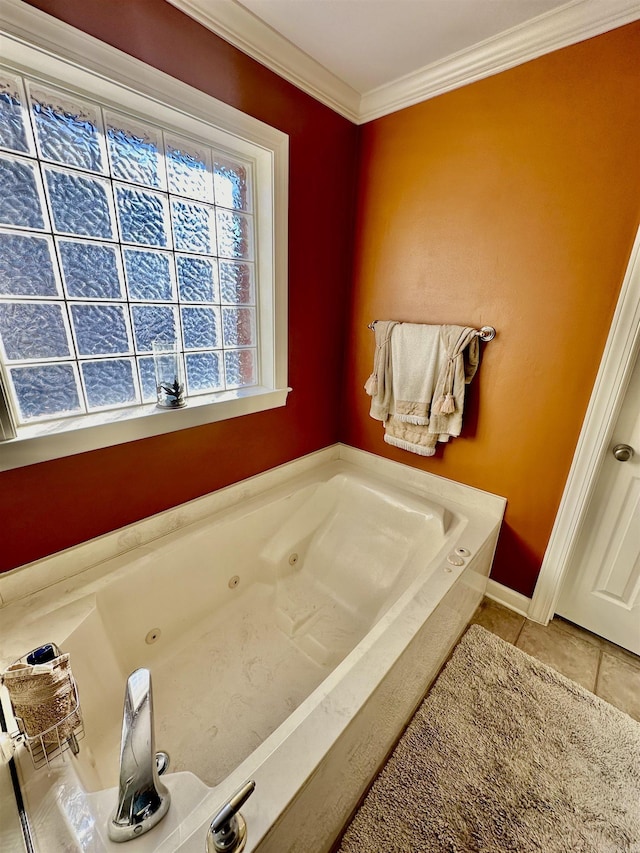 bathroom with tile patterned flooring, ornamental molding, and a washtub