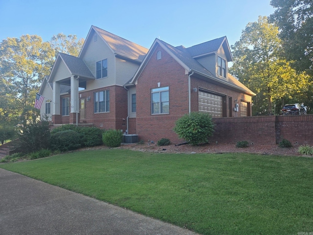 view of side of property with a garage and a lawn