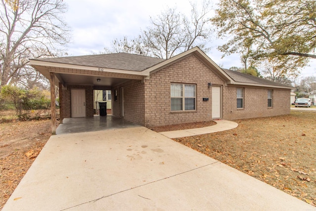 view of front of home featuring a carport