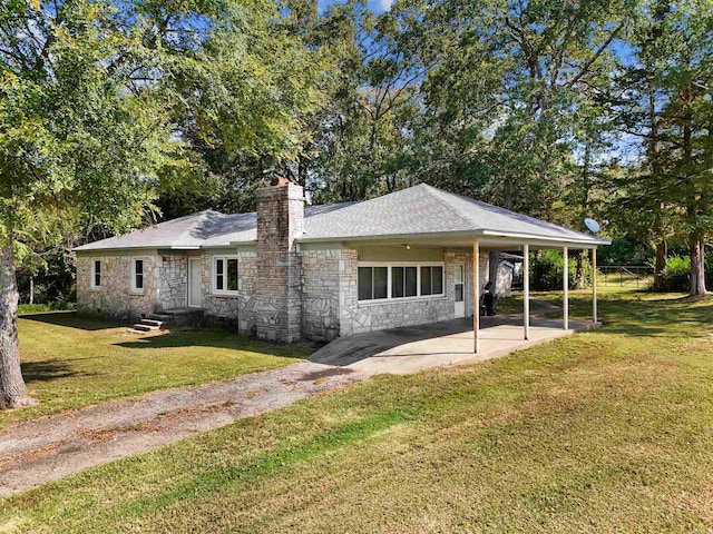 view of front facade featuring a front lawn and a patio area