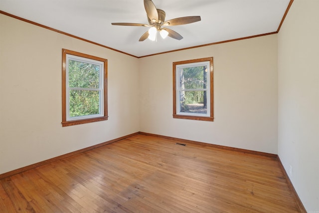 spare room featuring ceiling fan, light hardwood / wood-style flooring, and ornamental molding