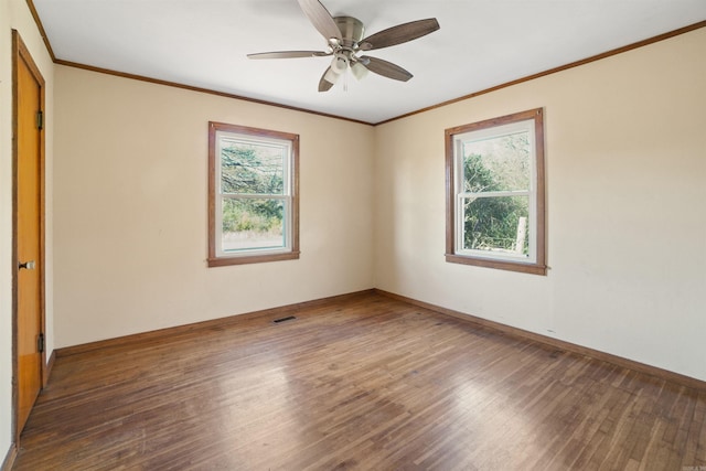 unfurnished room featuring ceiling fan, dark hardwood / wood-style flooring, and ornamental molding