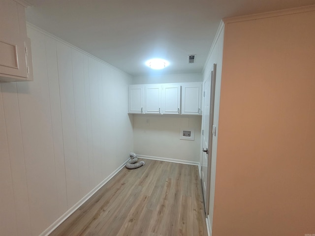 laundry room featuring washer hookup, cabinets, light wood-type flooring, and crown molding