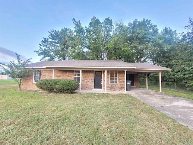 single story home featuring a front lawn and a carport