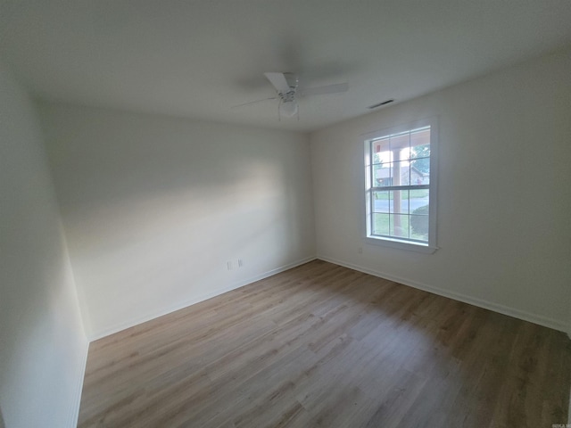 unfurnished room with ceiling fan and light hardwood / wood-style flooring