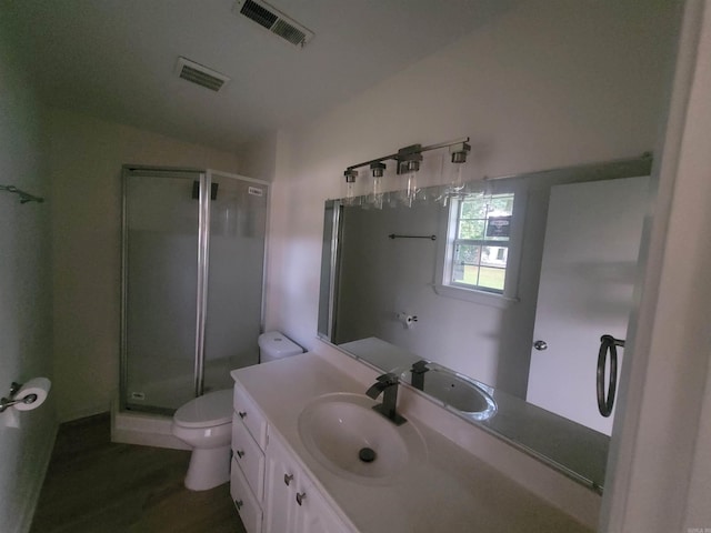 bathroom with vanity, wood-type flooring, an enclosed shower, and toilet