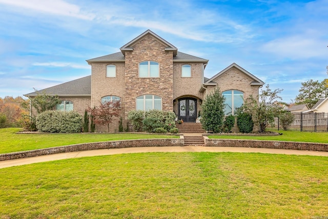 front of property with french doors and a front yard