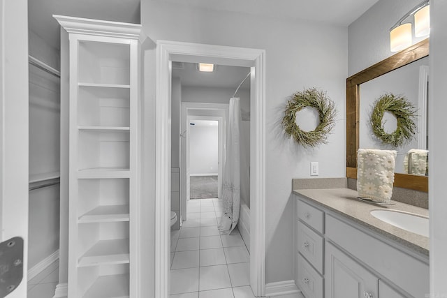 full bathroom featuring tile patterned flooring, vanity, toilet, and shower / bathtub combination with curtain