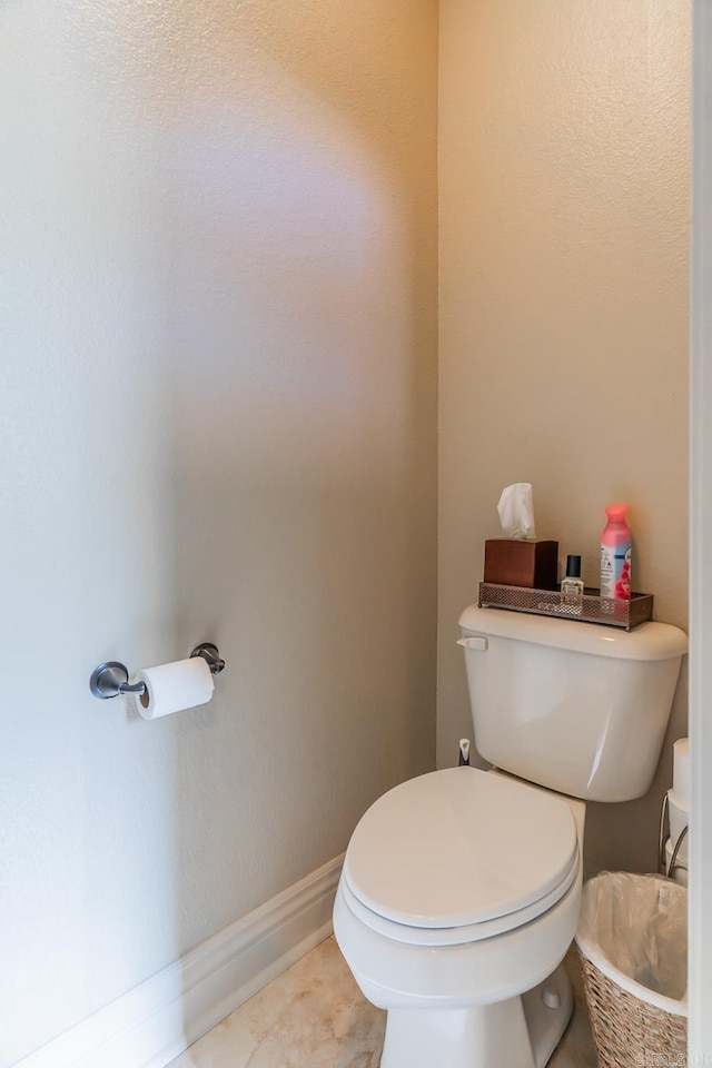 bathroom with tile patterned floors and toilet