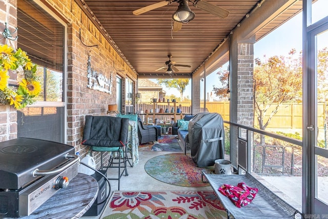 view of patio featuring ceiling fan and a grill