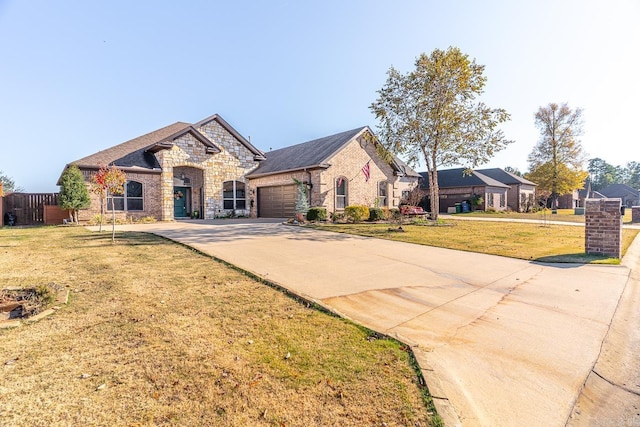 view of front facade featuring a garage and a front yard