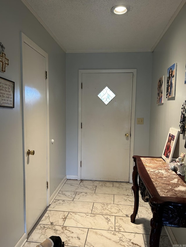 doorway with a textured ceiling and ornamental molding