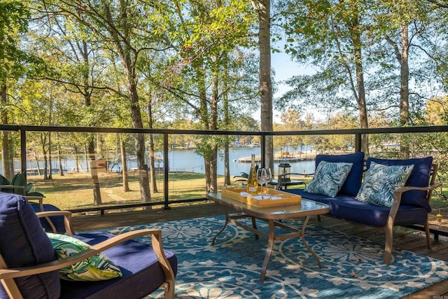 balcony featuring a deck with water view