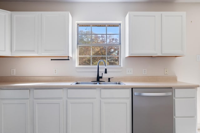 kitchen with white cabinetry, stainless steel dishwasher, and sink