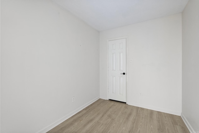 unfurnished room with light wood-type flooring