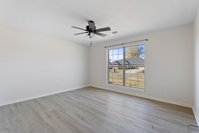 spare room featuring ceiling fan and light wood-type flooring